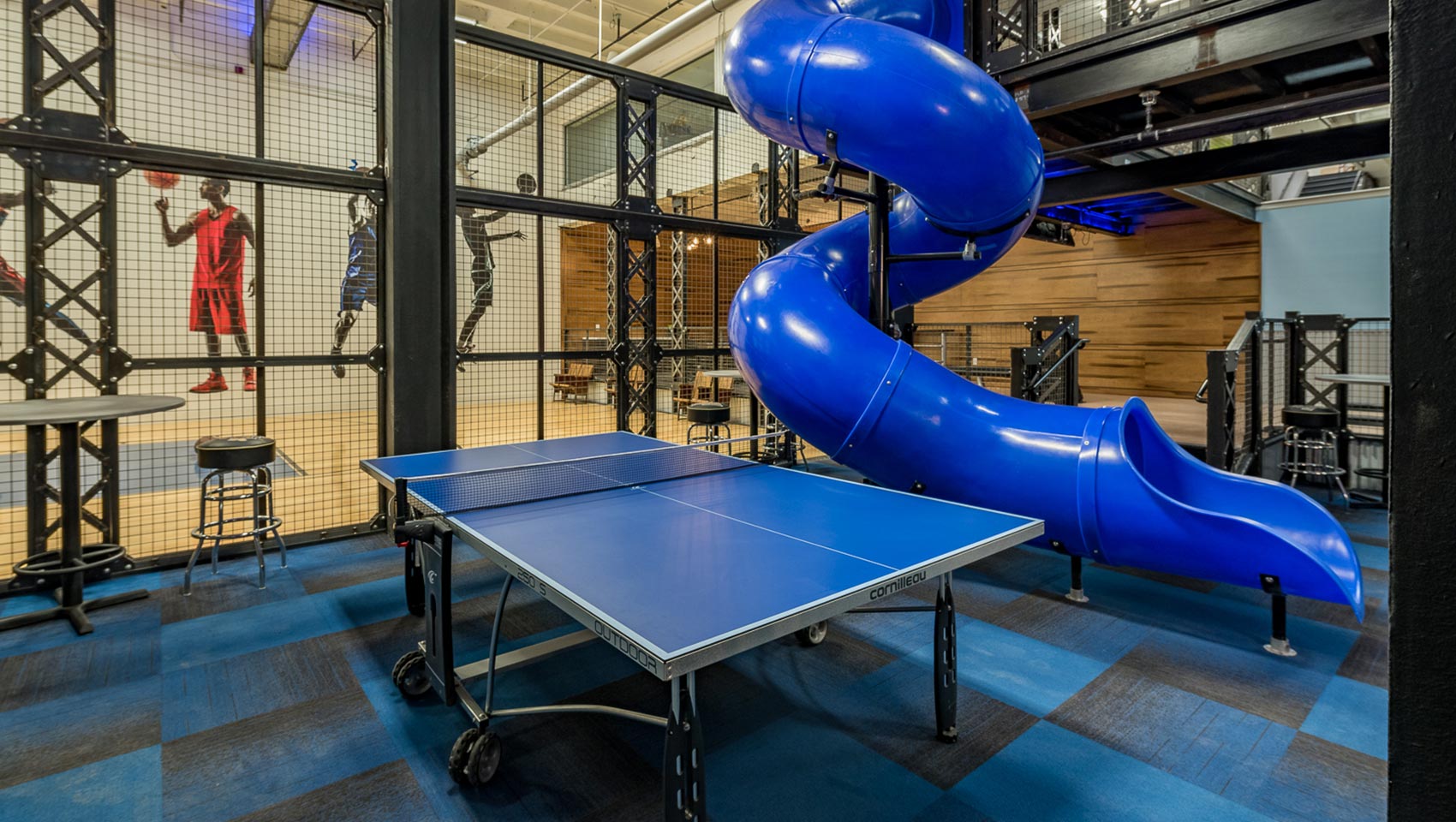 Recreation room with ping pong table and slide