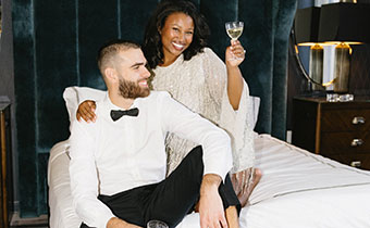 Bride and Groom on Cardinal Bed